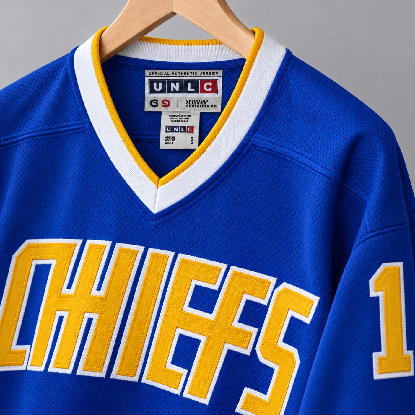 Denis Lemieux #1 Slap Shot Charlestown Chiefs Jersey – blue jersey on a hanger: CHIEFS twill, sleeve 1, UNLC label inside the neck