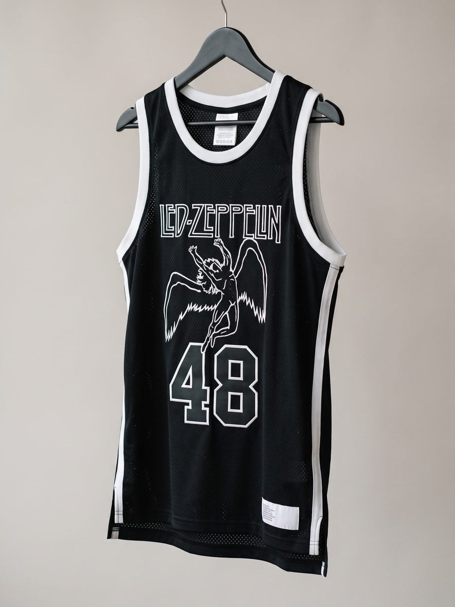 This jersey on a hanger, close enough to see the stitching, the fabric and the tags