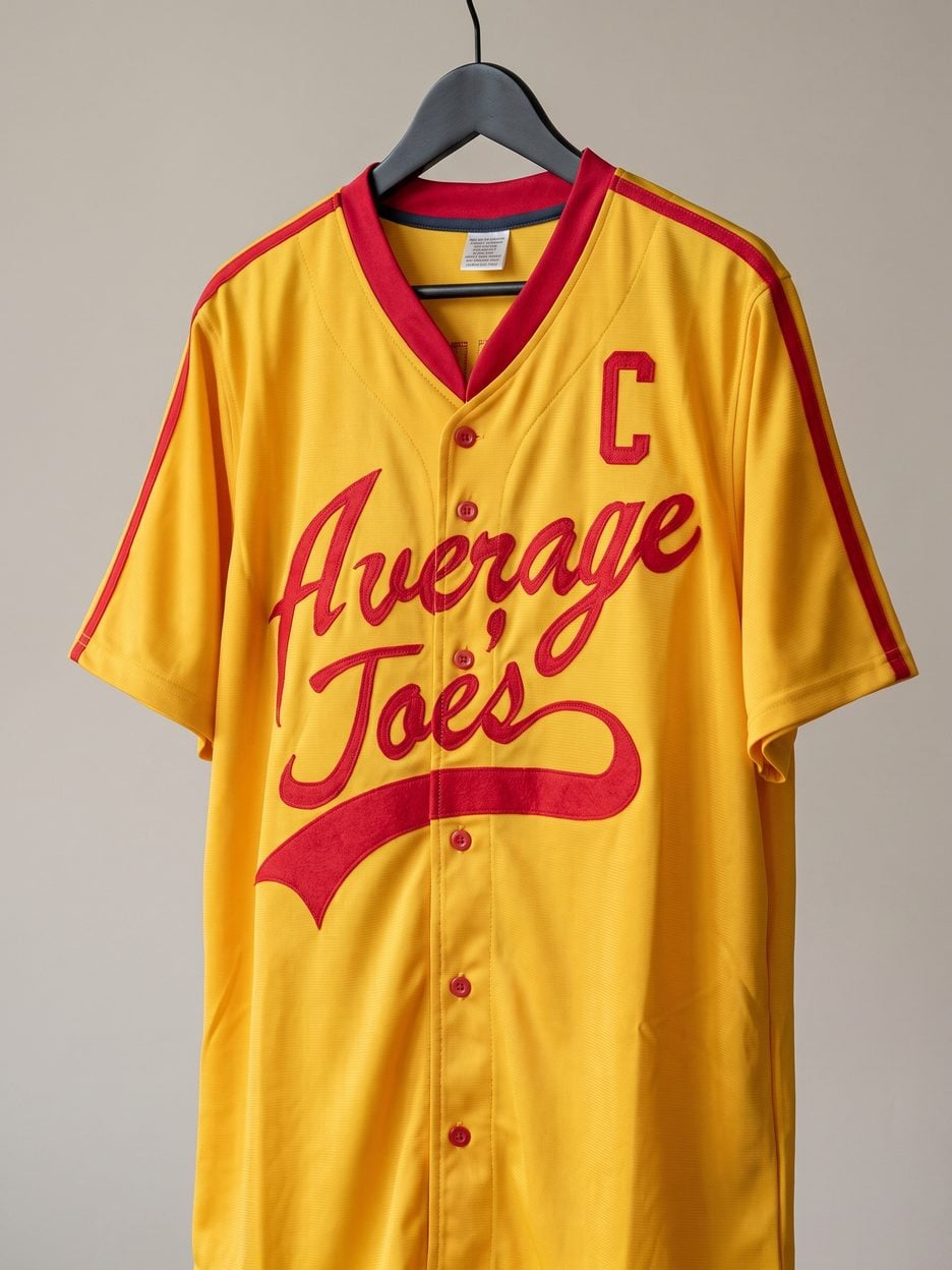 This jersey on a hanger, close enough to see the stitching, the fabric and the tags