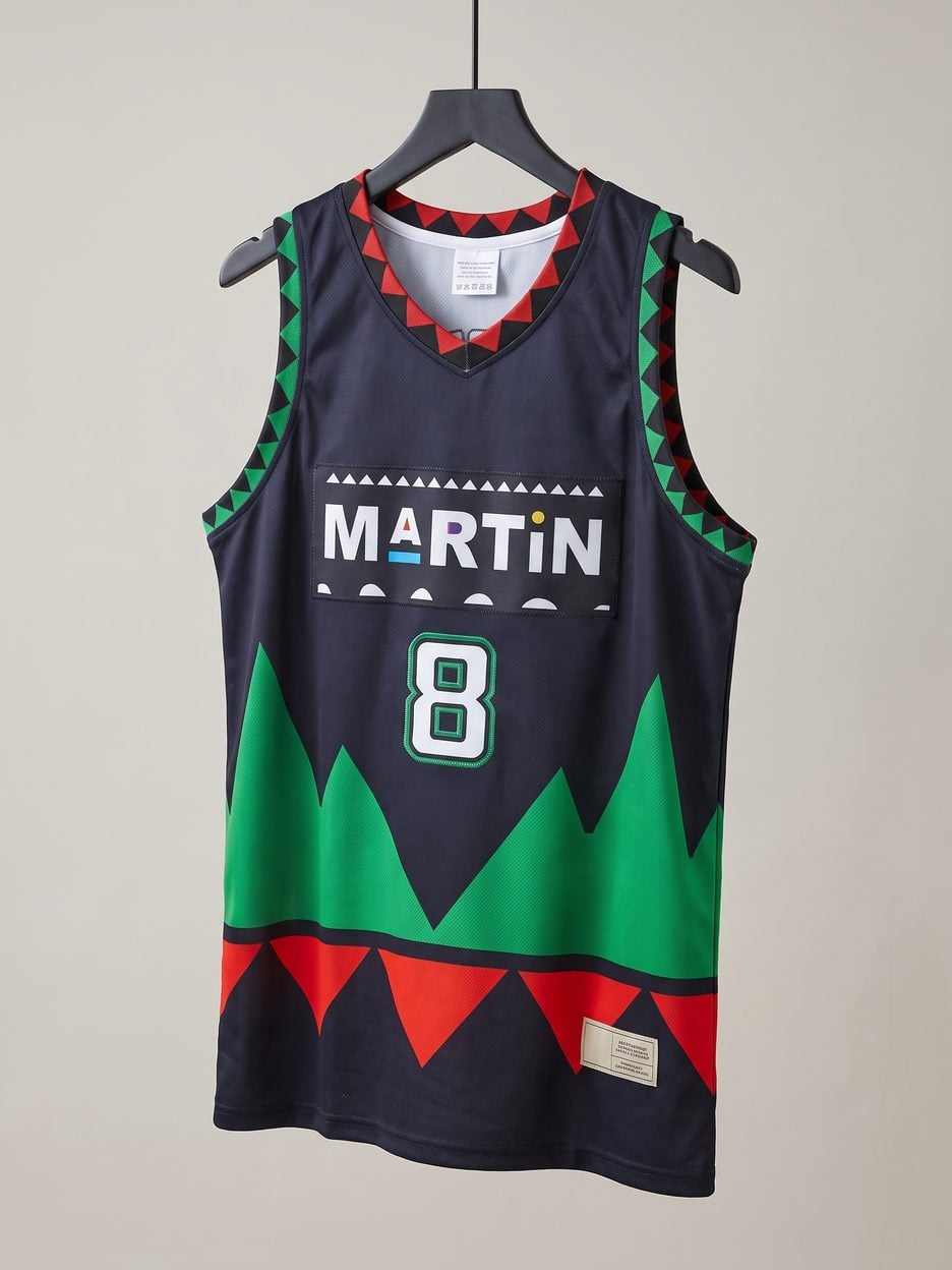 This jersey on a hanger, close enough to see the stitching, the fabric and the tags