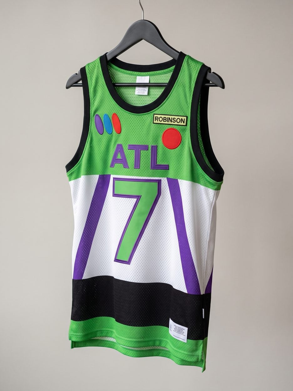This jersey on a hanger, close enough to see the stitching, the fabric and the tags