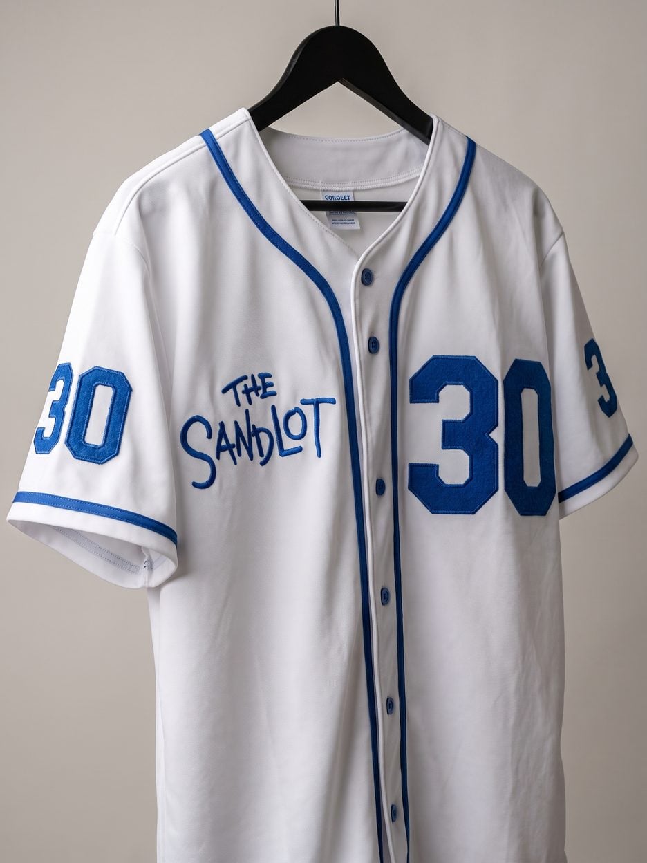 This jersey on a hanger, close enough to see the stitching, the fabric and the tags
