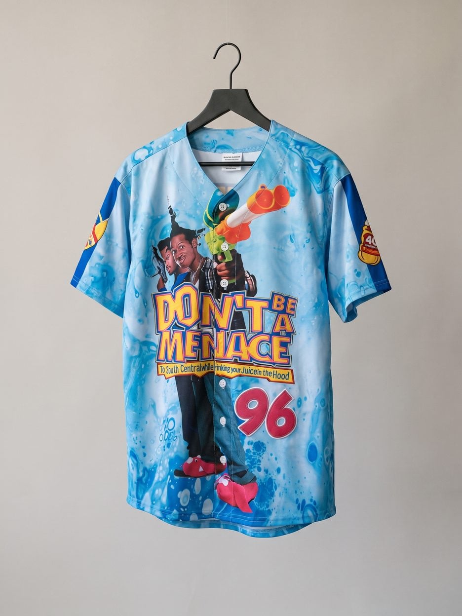 This jersey on a hanger, close enough to see the stitching, the fabric and the tags