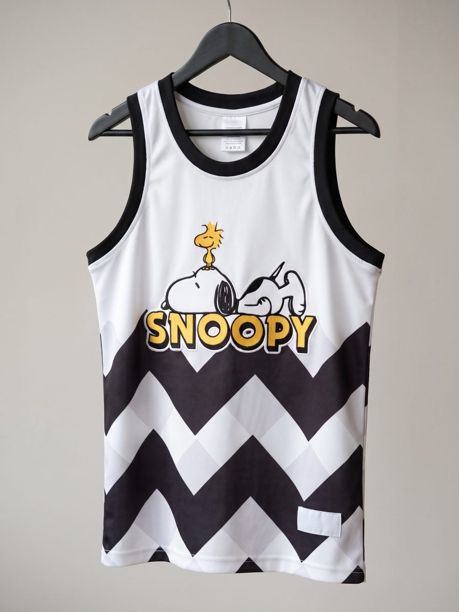 This jersey on a hanger, close enough to see the stitching, the fabric and the tags