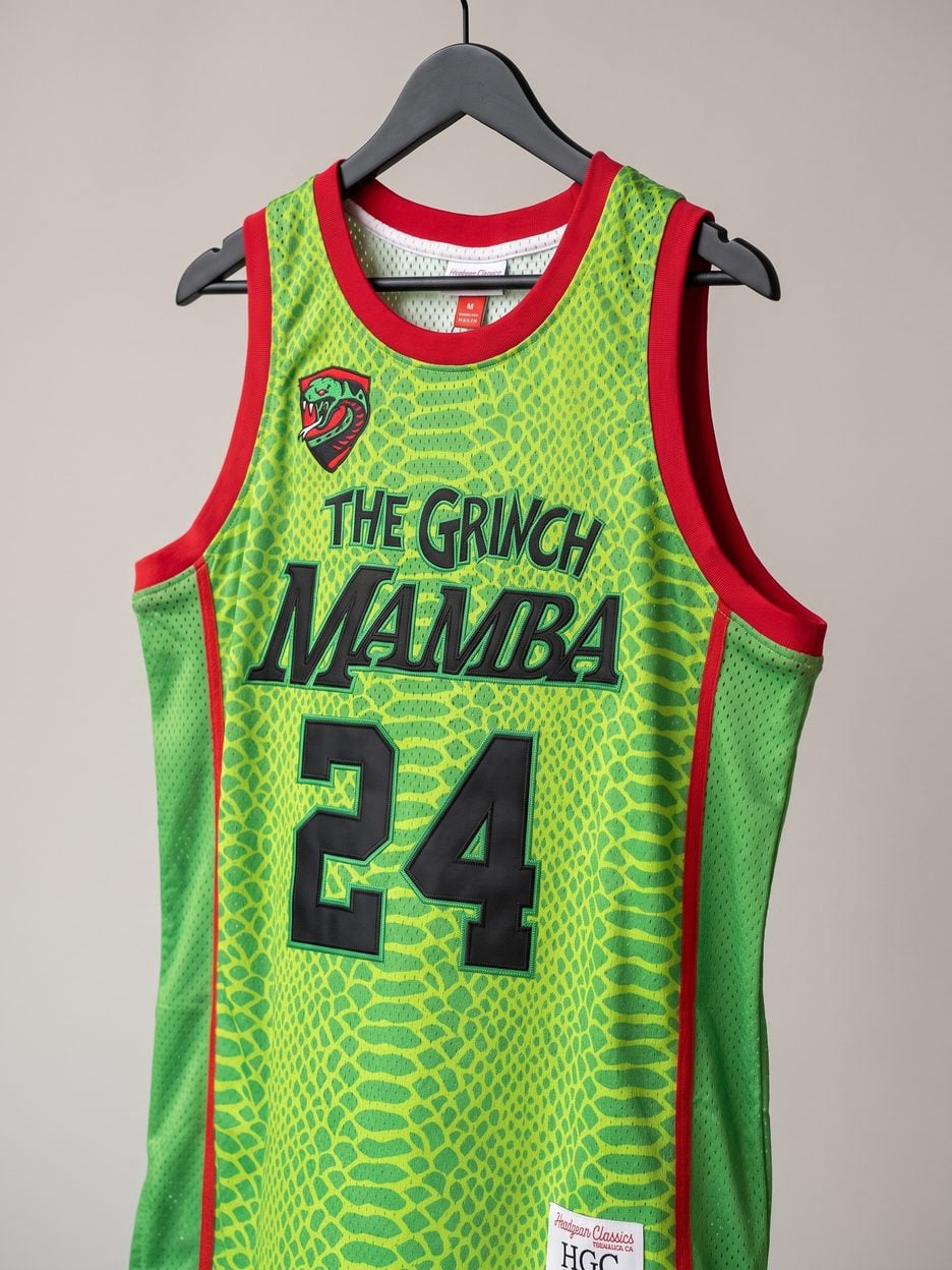 This jersey on a hanger, close enough to see the stitching, the fabric and the tags