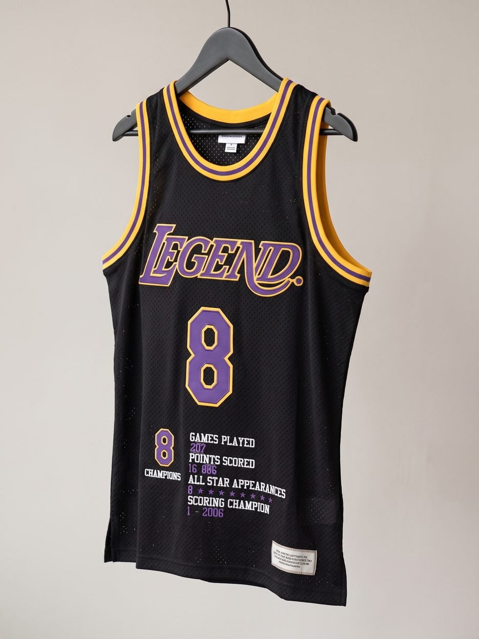 This jersey on a hanger, close enough to see the stitching, the fabric and the tags