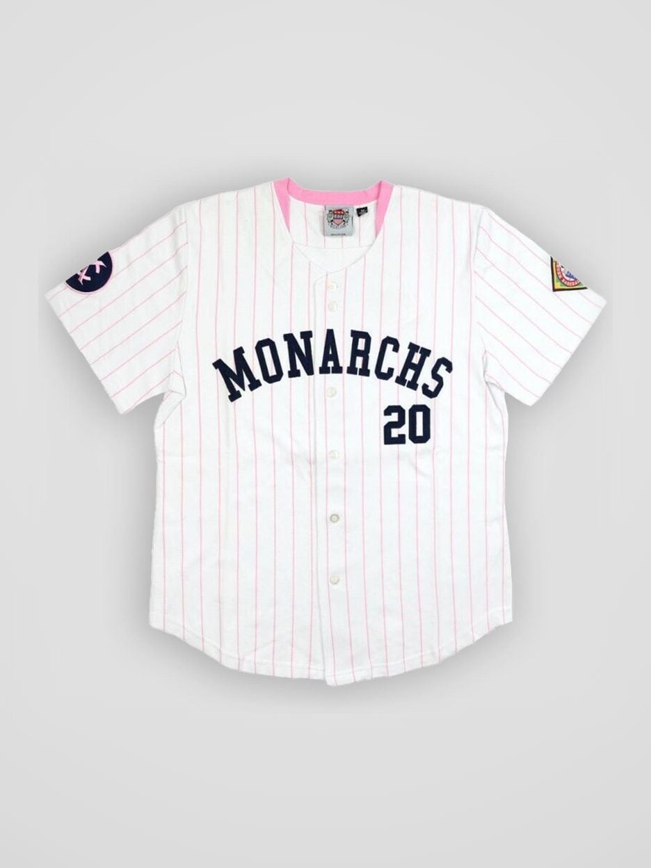 The NLBM Kansas City Monarchs #20 Pink Collar Women’s Jersey from the front: sewn lettering, an embroidered patch and the button front