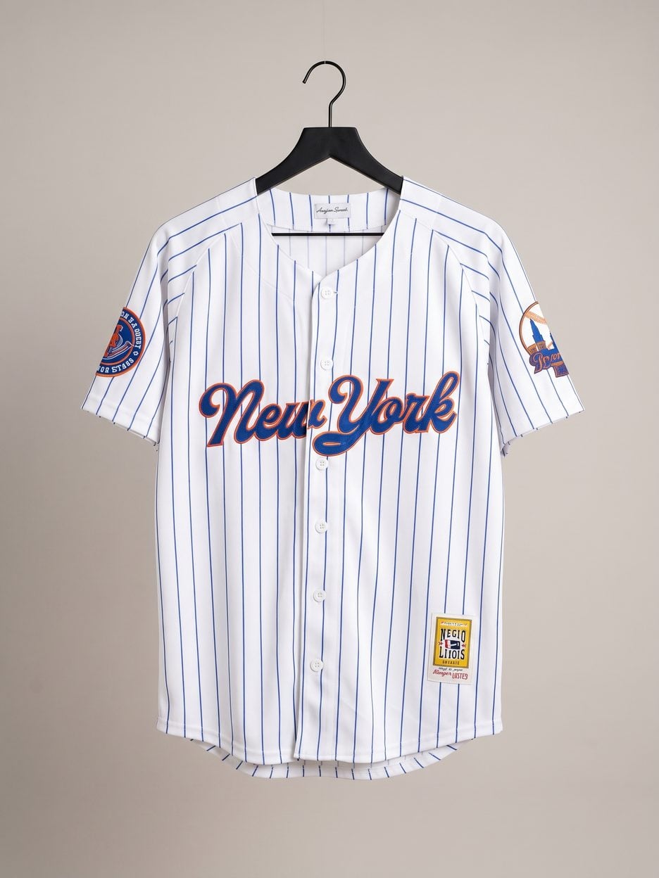 This jersey on a hanger, close enough to see the stitching, the fabric and the tags