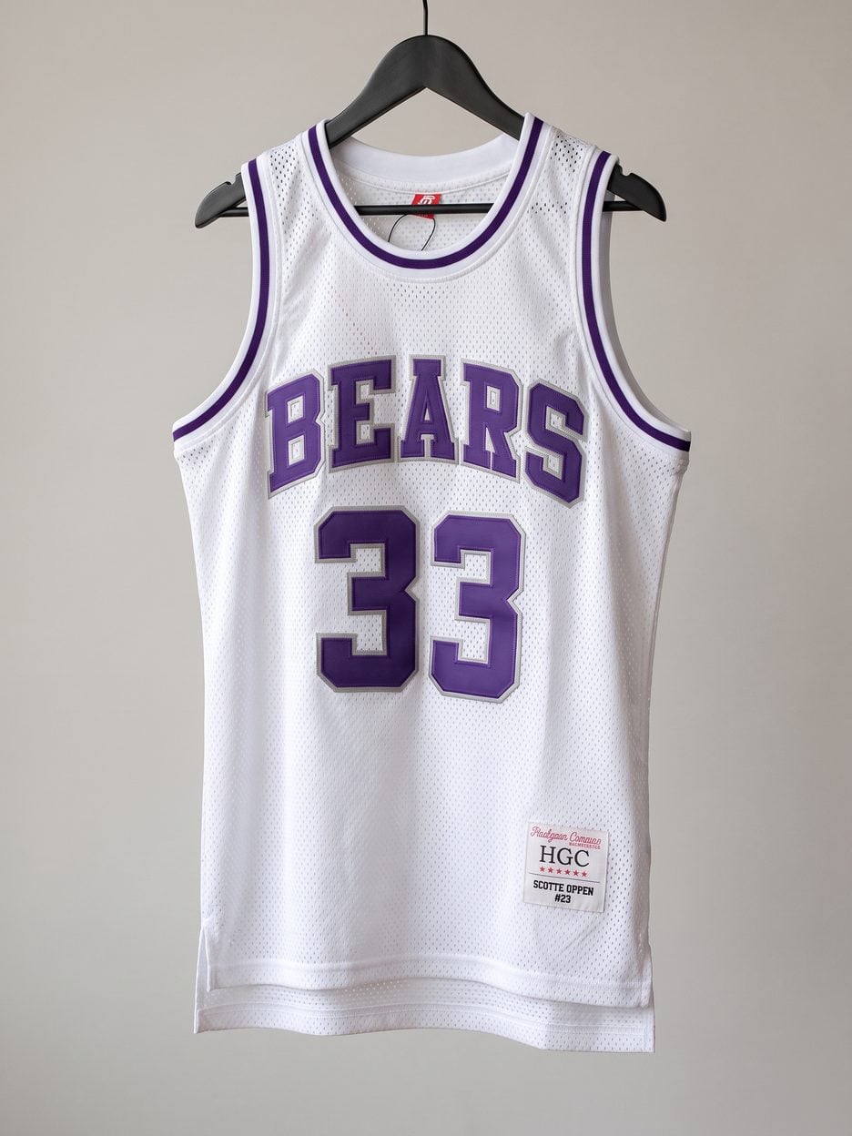 This jersey on a hanger, close enough to see the stitching, the fabric and the tags