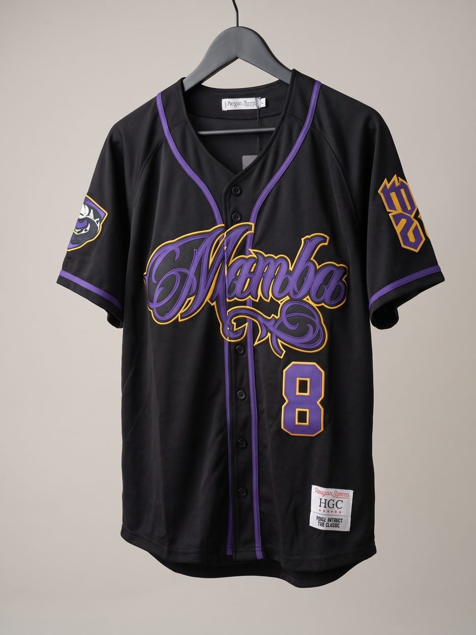 This jersey on a hanger, close enough to see the stitching, the fabric and the tags