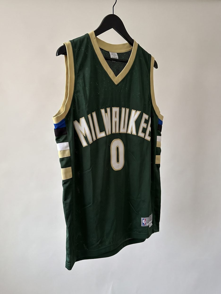 This jersey on a hanger, close enough to see the stitching, the fabric and the tags