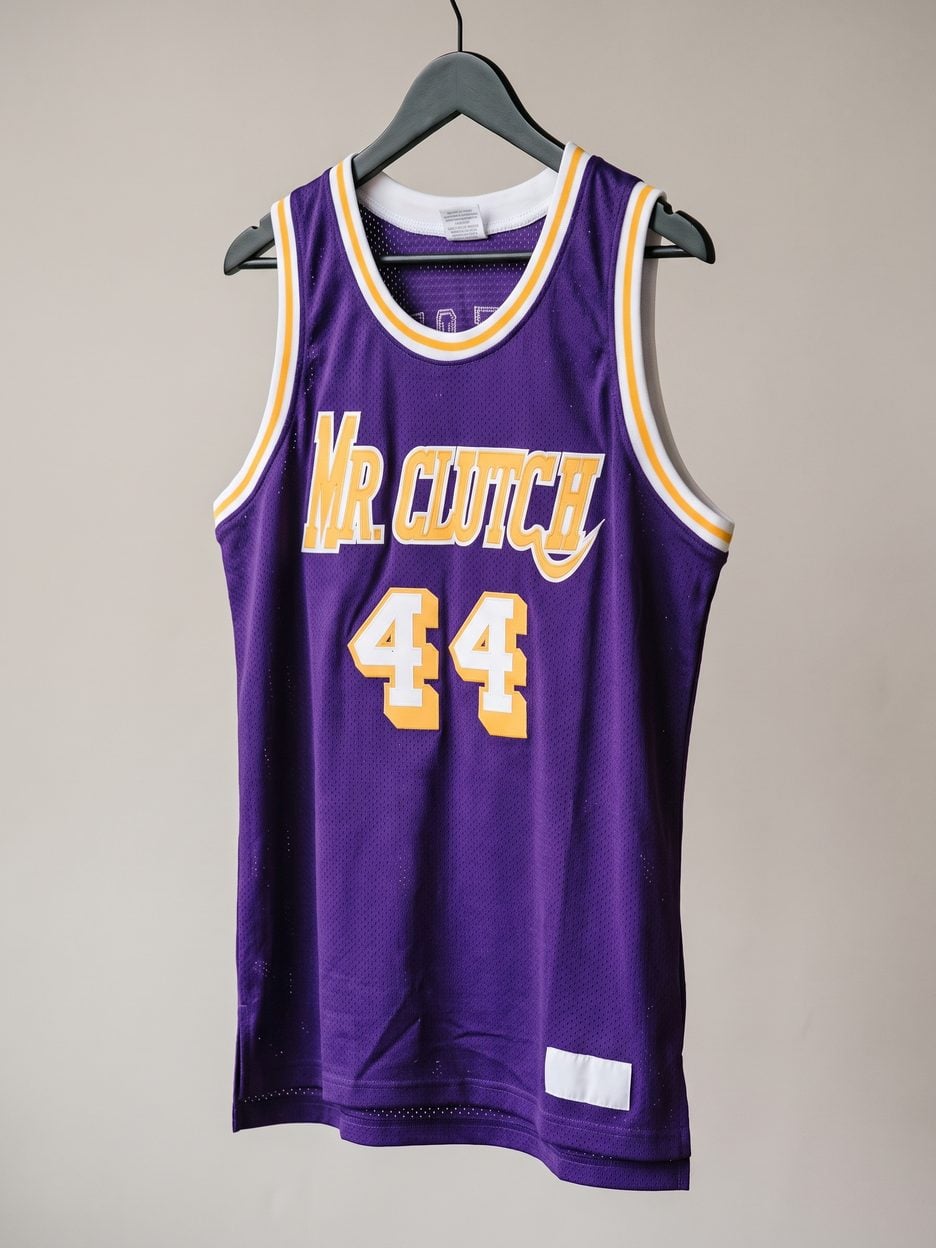 This jersey on a hanger, close enough to see the stitching, the fabric and the tags