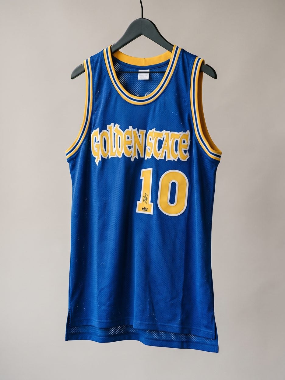 This jersey on a hanger, close enough to see the stitching, the fabric and the tags