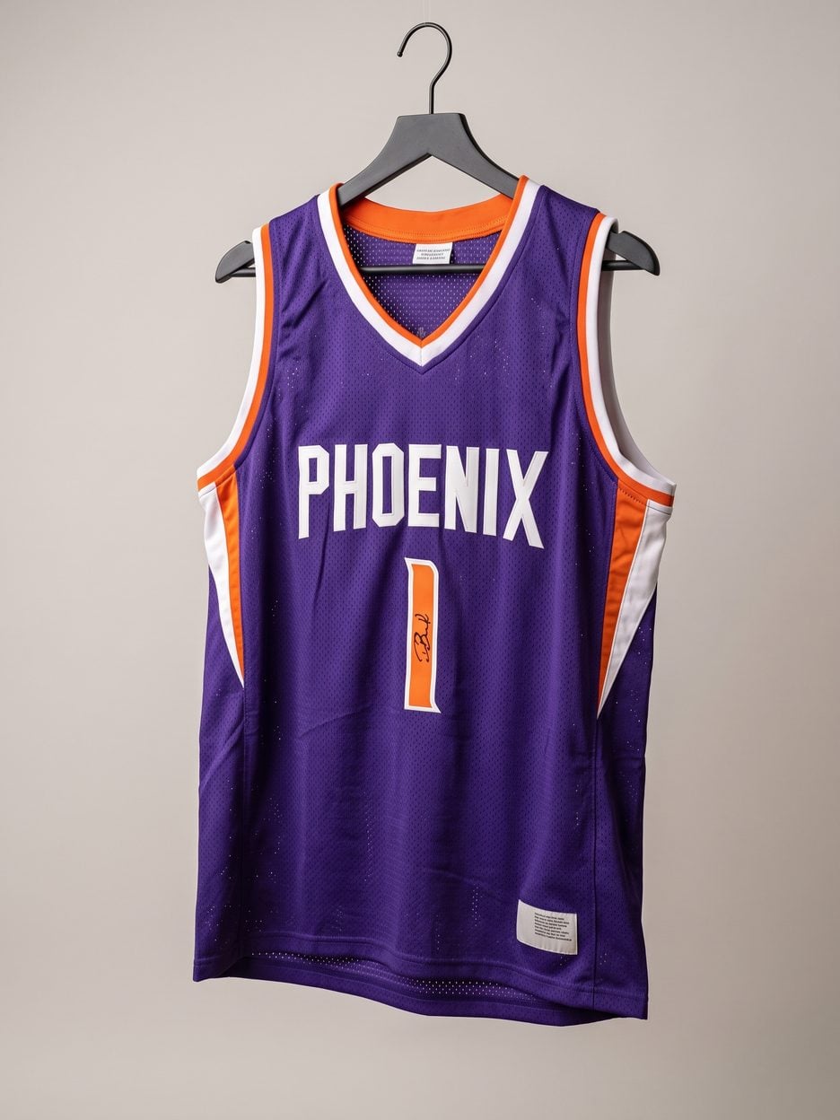 This jersey on a hanger, close enough to see the stitching, the fabric and the tags