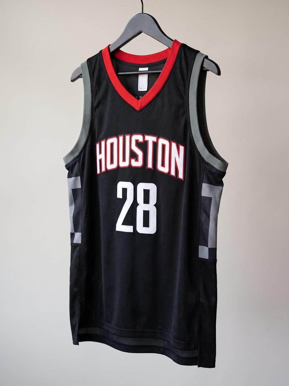 This jersey on a hanger, close enough to see the stitching, the fabric and the tags