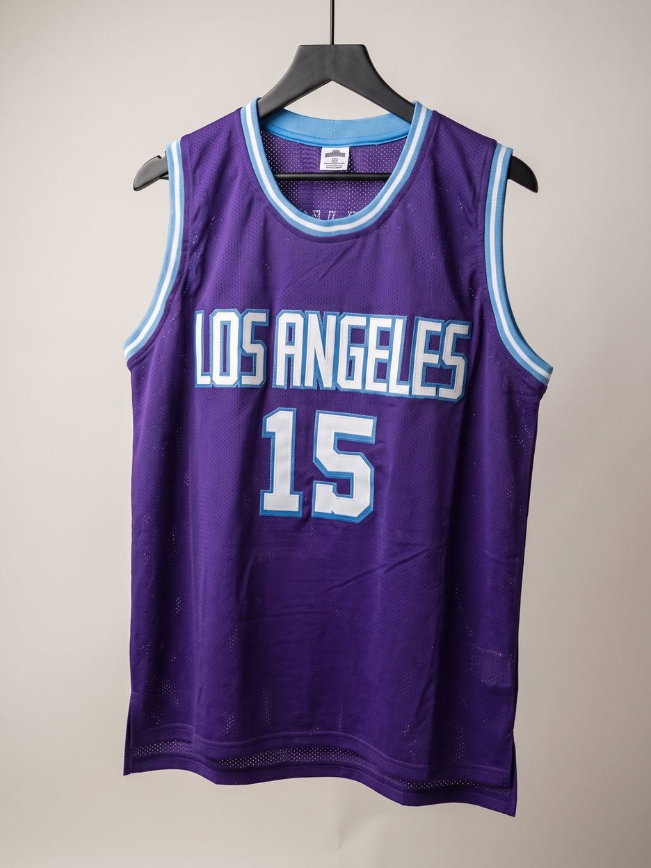 This jersey on a hanger, close enough to see the stitching, the fabric and the tags