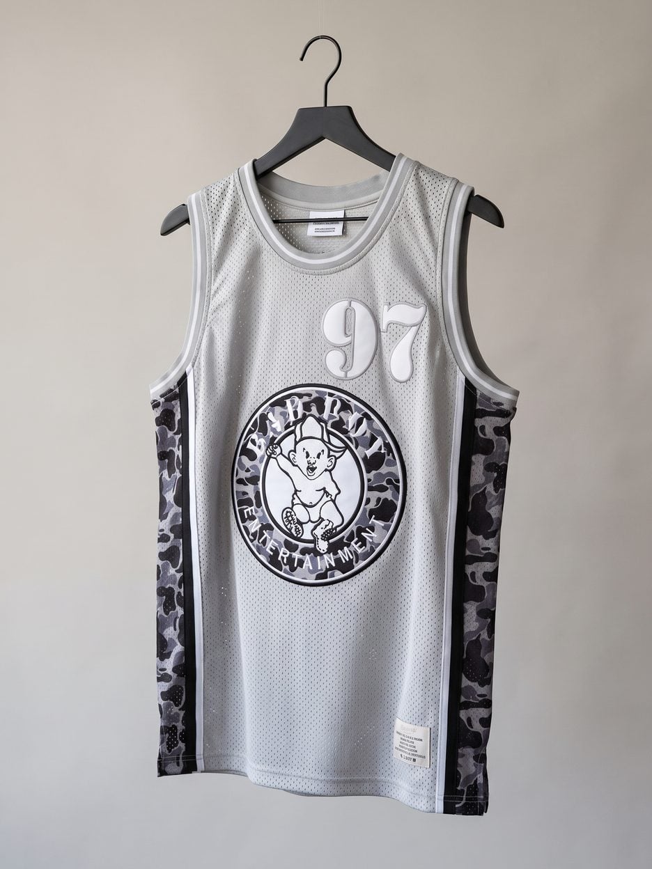 This jersey on a hanger, close enough to see the stitching, the fabric and the tags