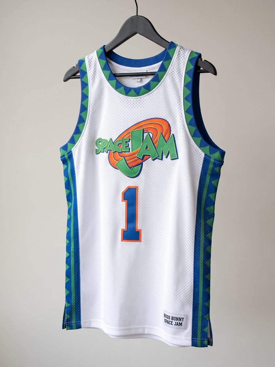 This jersey on a hanger, close enough to see the stitching, the fabric and the tags