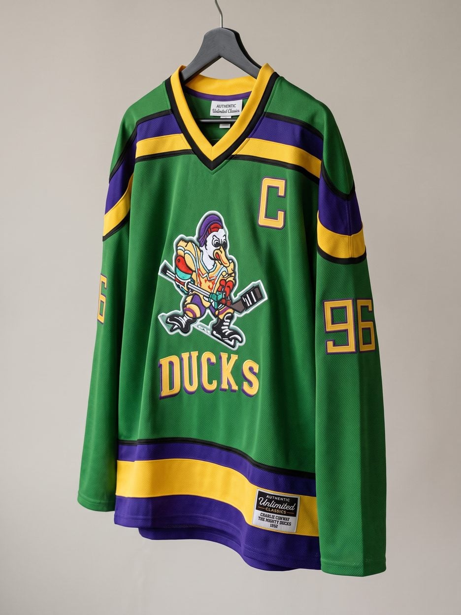 This jersey on a hanger, close enough to see the stitching, the fabric and the tags