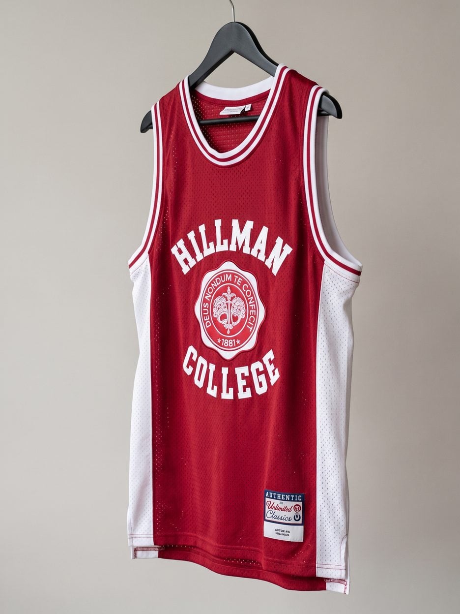 This jersey on a hanger, close enough to see the stitching, the fabric and the tags