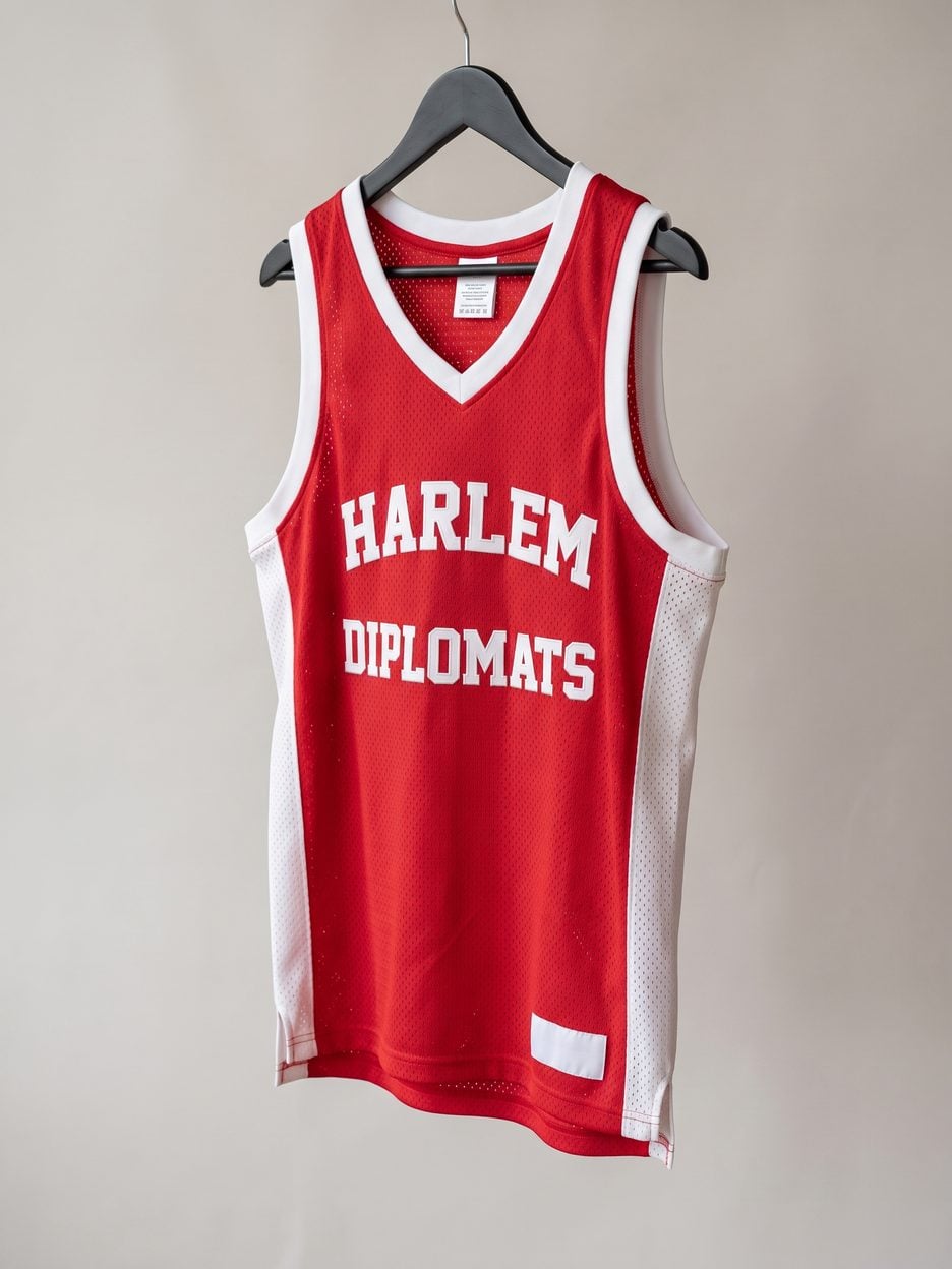 This jersey on a hanger, close enough to see the stitching, the fabric and the tags