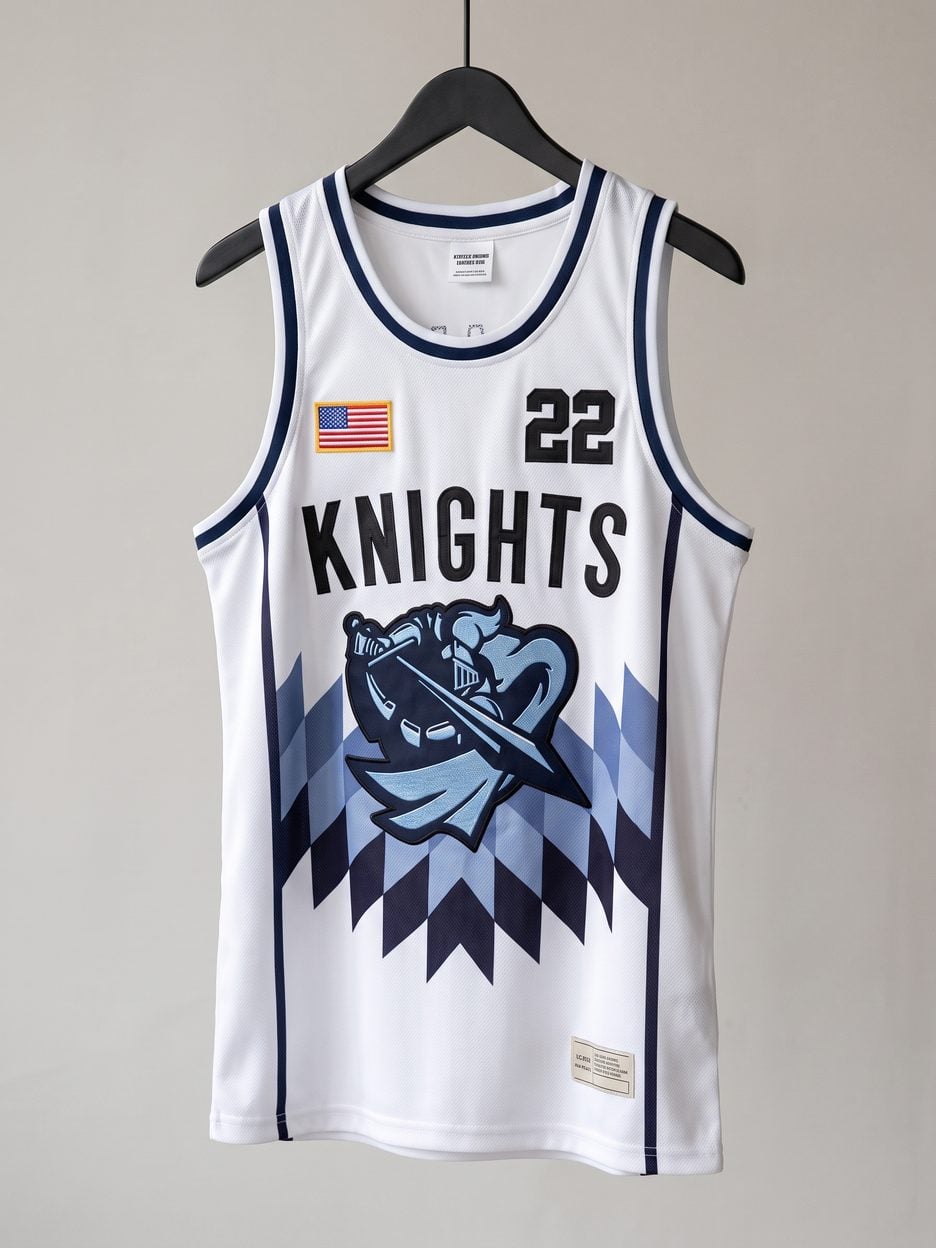 This jersey on a hanger, close enough to see the stitching, the fabric and the tags