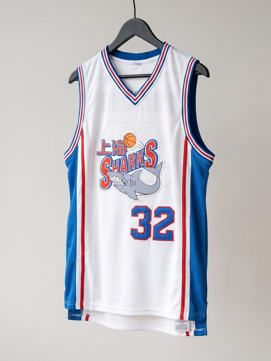 This jersey on a hanger, close enough to see the stitching, the fabric and the tags