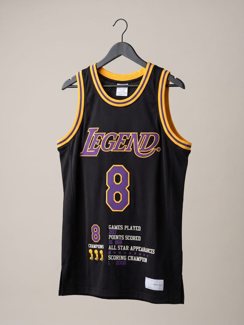 This jersey on a hanger, close enough to see the stitching, the fabric and the tags