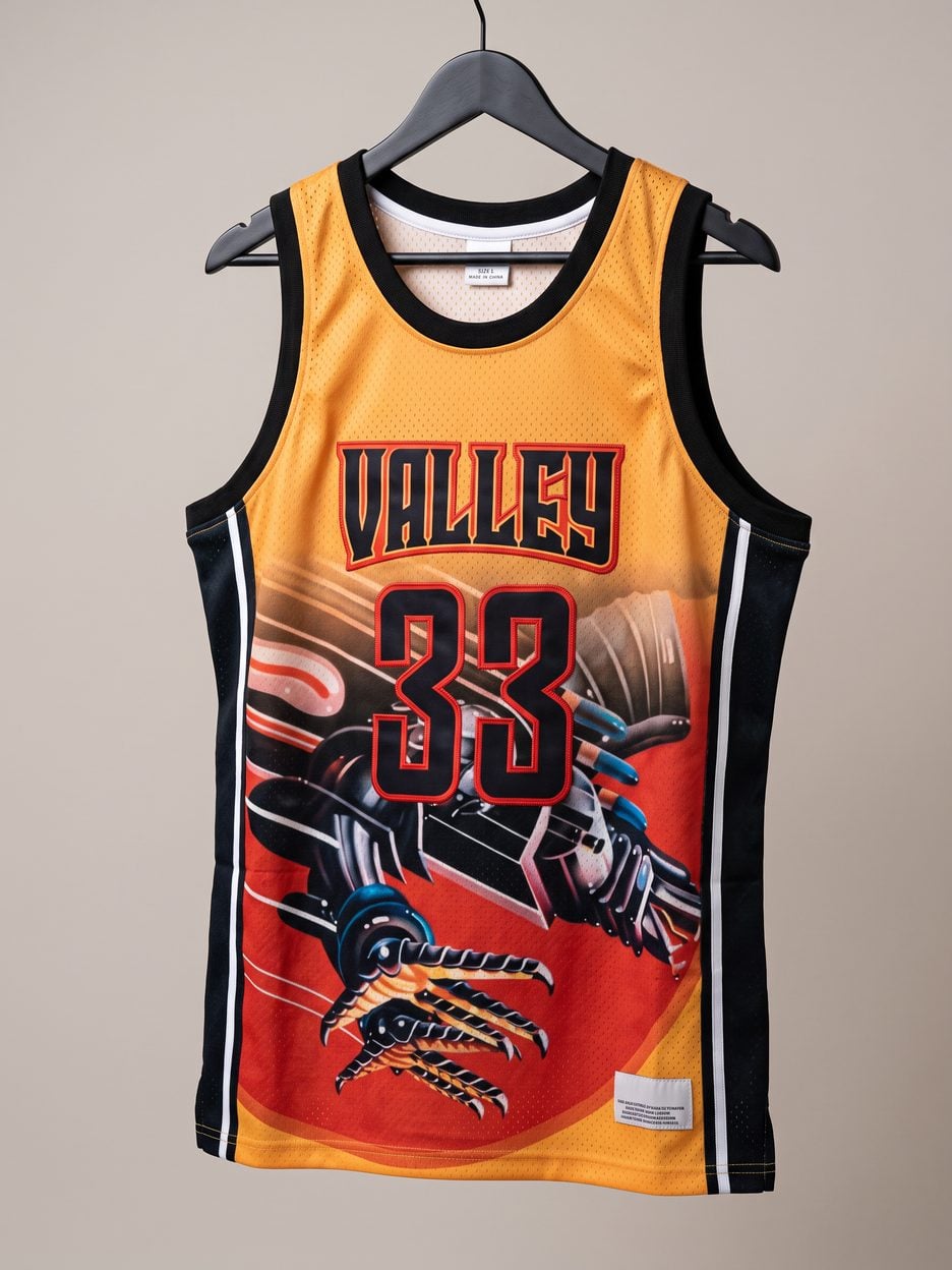 This jersey on a hanger, close enough to see the stitching, the fabric and the tags