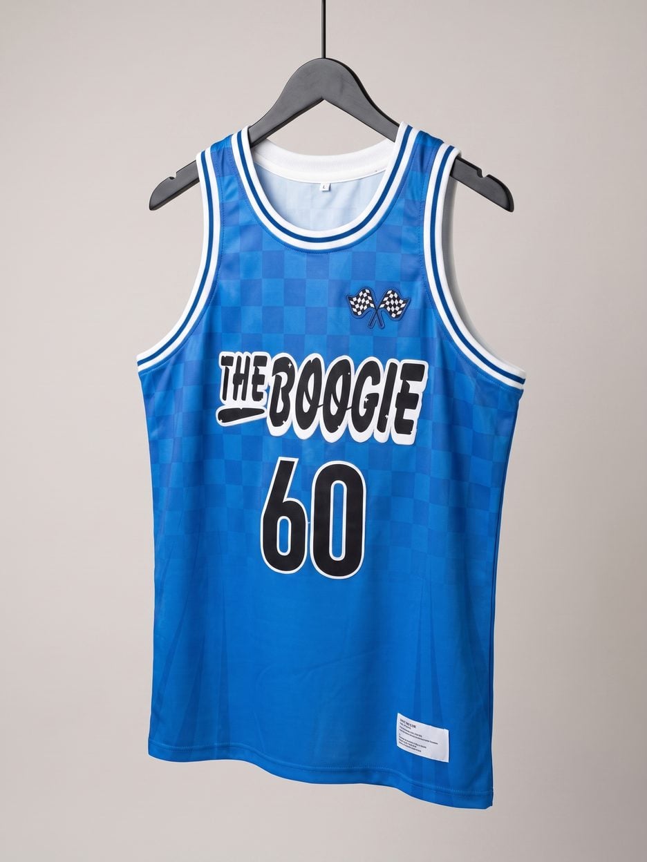 This jersey on a hanger, close enough to see the stitching, the fabric and the tags