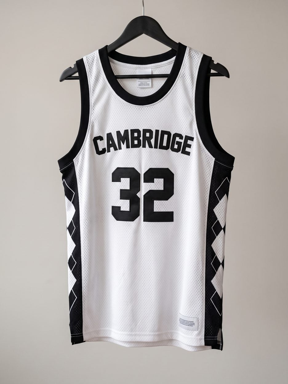 This jersey on a hanger, close enough to see the stitching, the fabric and the tags