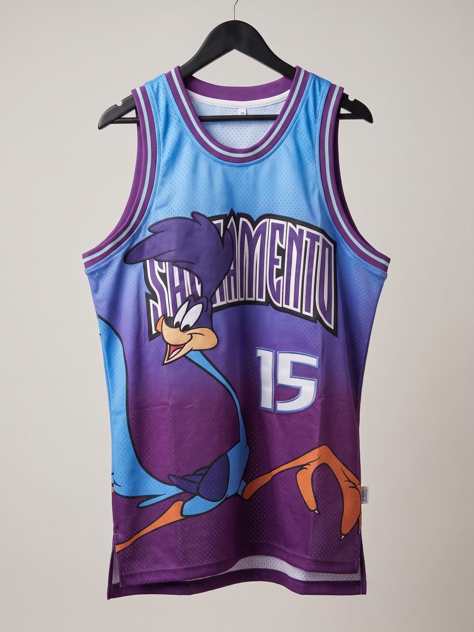 This jersey on a hanger, close enough to see the stitching, the fabric and the tags