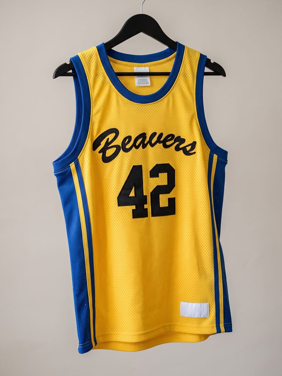 This jersey on a hanger, close enough to see the stitching, the fabric and the tags
