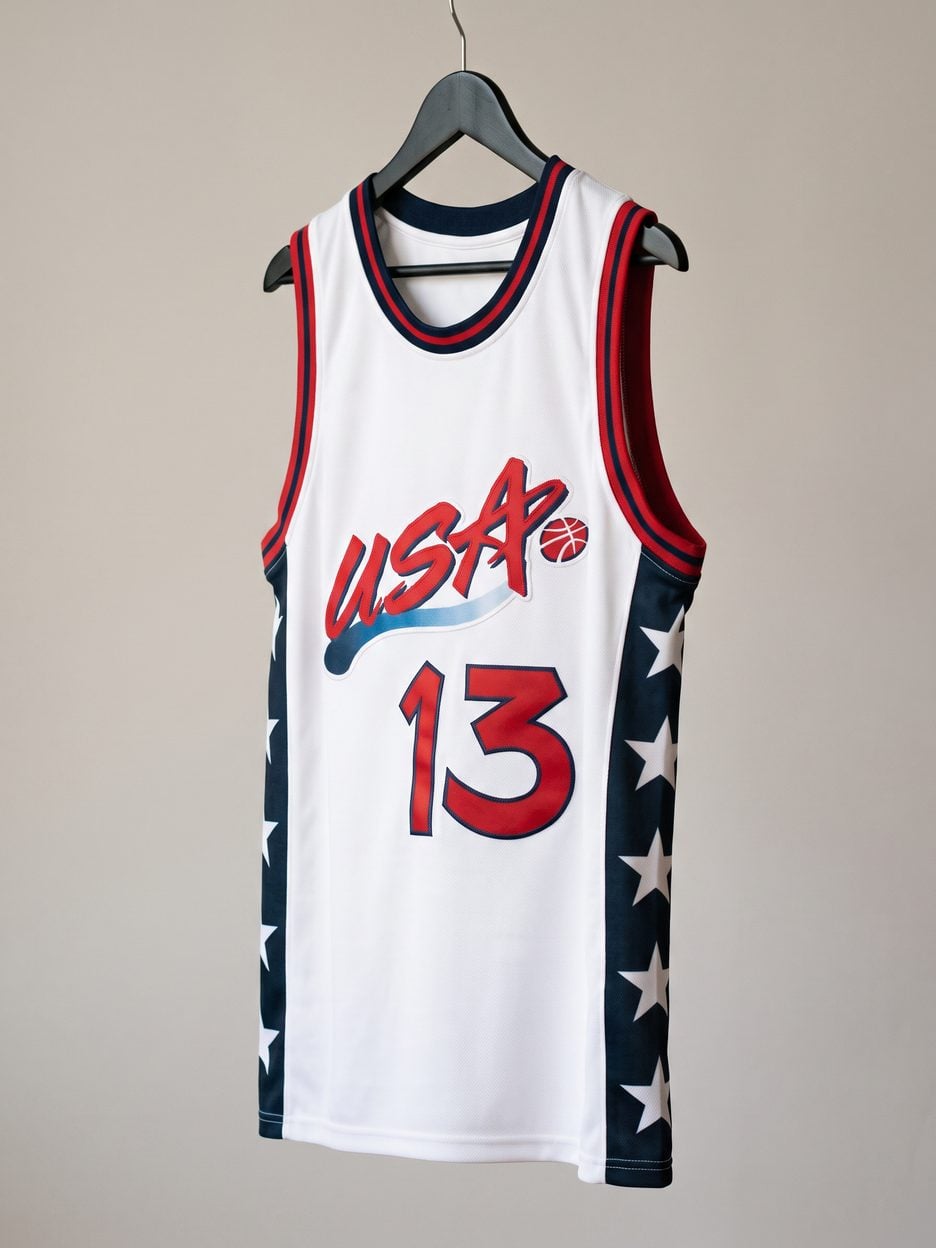 This jersey on a hanger, close enough to see the stitching, the fabric and the tags