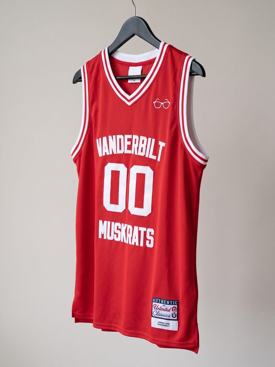 This jersey on a hanger, close enough to see the stitching, the fabric and the tags