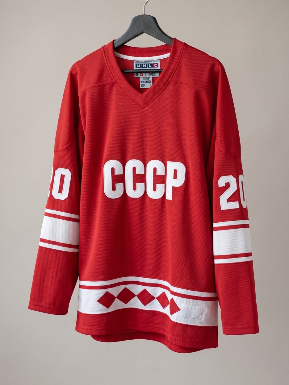 This jersey on a hanger, close enough to see the stitching, the fabric and the tags