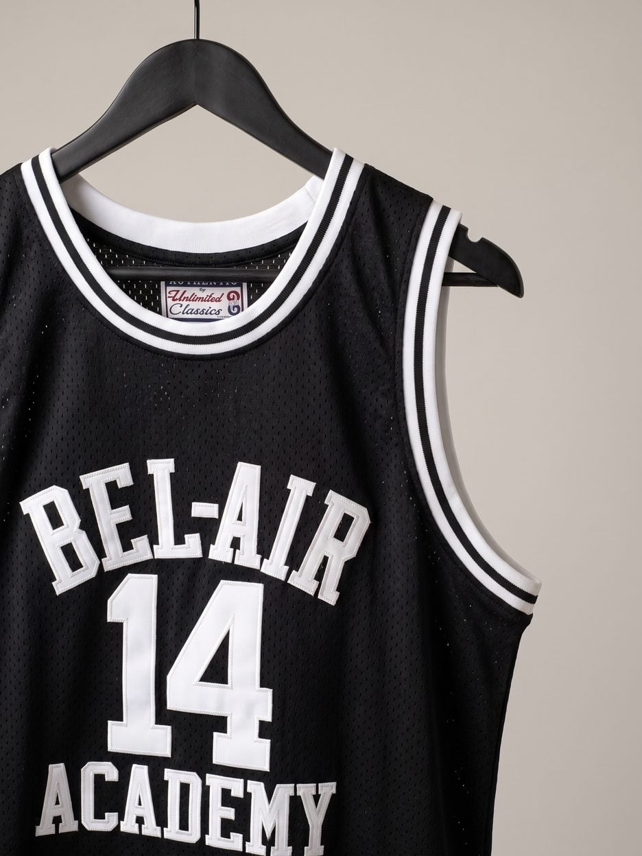 This jersey on a hanger, close enough to see the stitching, the fabric and the tags